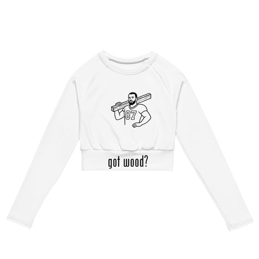 White crop top with graphic design and text 'got wood?' on a white background