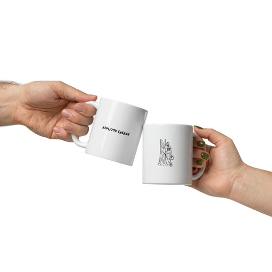 Two hands holding white mugs with text and graphics on a white background