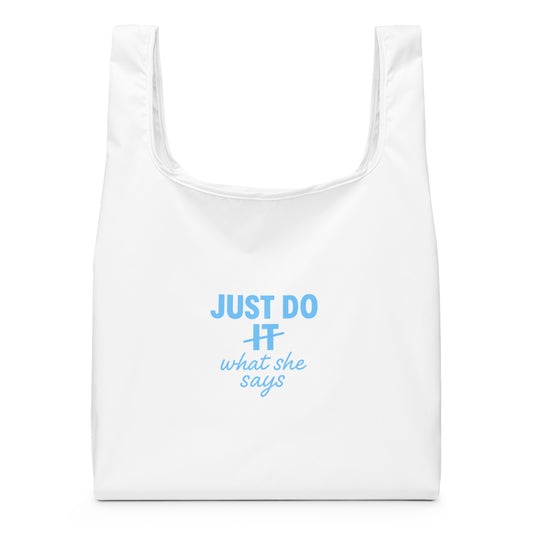 Image of a white tote bag with the Just Do what she says slogan on it.