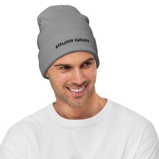 Man wearing a gray beanie with 'Redwood Energy' text on a white background